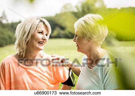 Two women resting after exercise View Large Photo Image Stock Image - Two women resting after exercise. Fotosearch