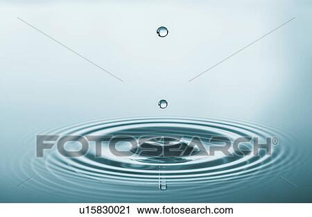 Stock Image - Water droplet on water surface.. Fotosearch