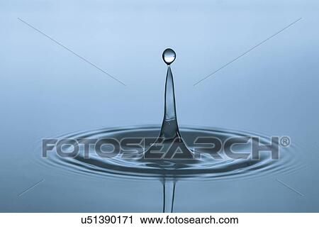 Stock Image - Water droplet on water surface.. Fotosearch