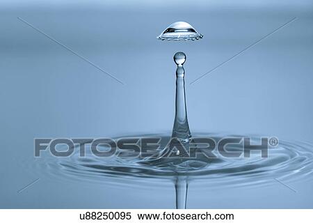 Stock Photography - Water droplet on water surface.. Fotosearch
