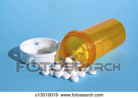Stock Photo - White tablets in plastic bottle, studio shot.. Fotosearch