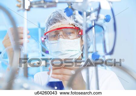 Woman doing experiment in chemical laboratory View Large Photo Image Stock Image - Woman doing experiment in chemical laboratory. Fotosearch