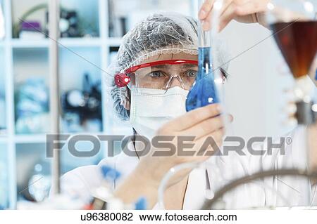 Woman doing experiment in chemical laboratory View Large Photo Image Stock Image - Woman doing experiment in chemical laboratory. Fotosearch