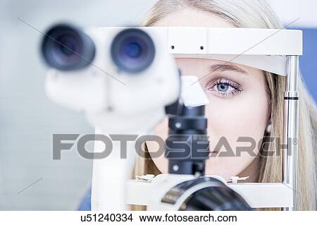 Picture - Woman having eye examination. Fotosearch