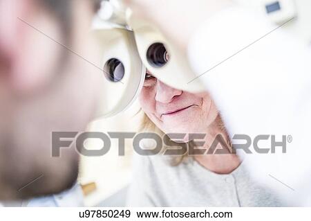 Woman having eye examination View Large Photo Image Stock Photo - Woman having eye examination. Fotosearch