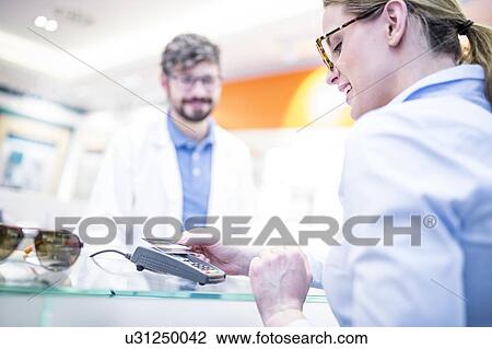 Woman paying with credit card View Large Photo Image Stock Image - Woman paying with credit card. Fotosearch