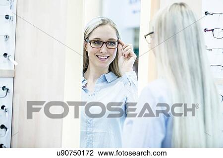 Woman wearing glasses View Large Photo Image Stock Image - Woman wearing glasses. Fotosearch