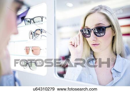 Woman wearing sunglasses View Large Photo Image Stock Photo - Woman wearing sunglasses. Fotosearch
