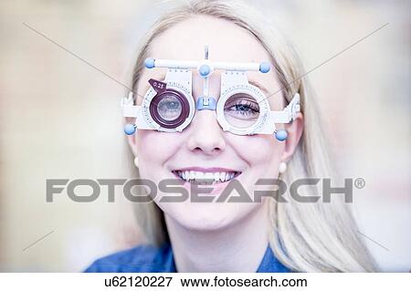 Woman wearing trial frame View Large Photo Image Stock Photo - Woman wearing trial frame. Fotosearch