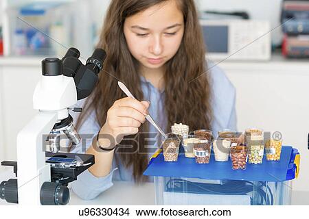 Picture - Scientist testing foods. Fotosearch