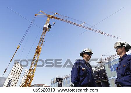 Construction workers on site View Large Photo Image Stock Image - Construction workers on site. Fotosearch