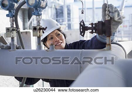 Picture - Female engineer working at power plant. Fotosearch