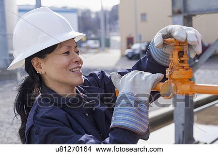 Picture - Female engineer working at power plant. Fotosearch