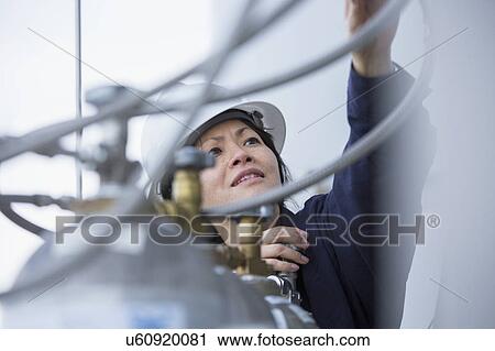 Female engineer working at power plant View Large Photo Image Stock Image - Female engineer working at power plant. Fotosearch