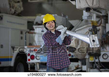 Stock Photo - Female engineer working at power plant. Fotosearch