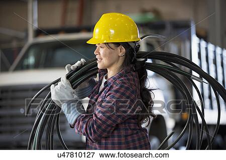 Stock Photo - Female engineer working at power plant. Fotosearch