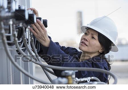 Female engineer working at power plant View Large Photo Image Stock Photo - Female engineer working at power plant. Fotosearch