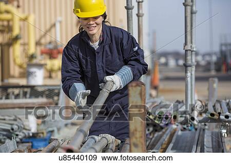 Stock Photo - Female engineer working at power plant. Fotosearch