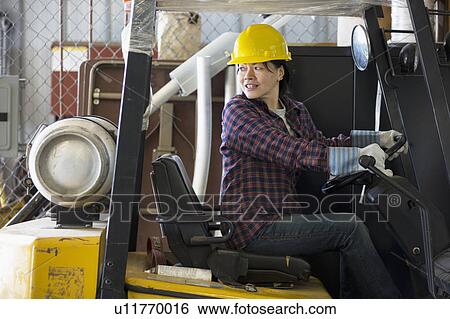 Stock Photograph - Female engineer working at power plant. Fotosearch