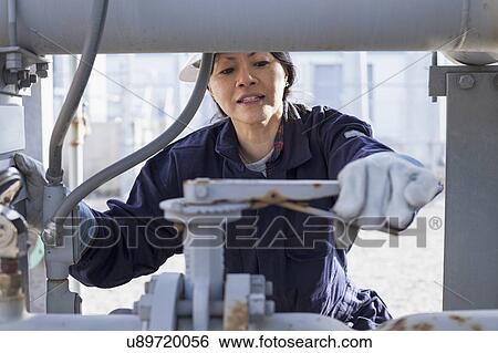 Female engineer working at power plant View Large Photo Image Stock Photograph - Female engineer working at power plant. Fotosearch