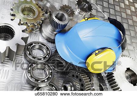 Stock Image - Hard hat and mechanical parts. Fotosearch