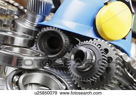 Hard hat and mechanical parts View Large Photo Image Stock Photo - Hard hat and mechanical parts. Fotosearch