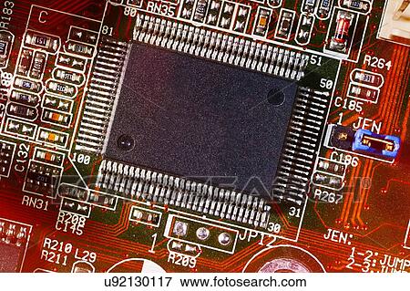 Stock Photo - Large micro-chip and motherboard. Fotosearch