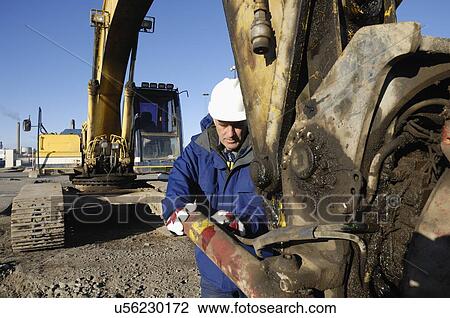 Man operating bulldozer View Large Photo Image Stock Image - Man operating bulldozer. Fotosearch