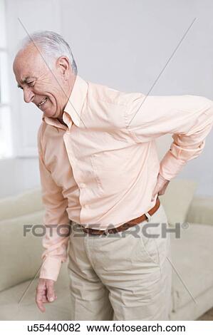Man with back pain View Large Photo Image Stock Image - Man with back pain. Fotosearch
