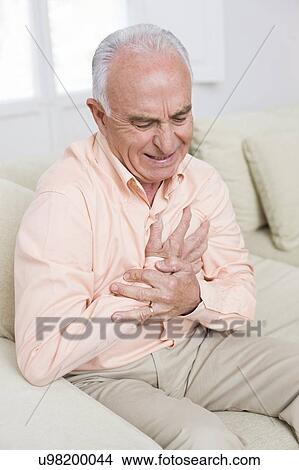 Man with chest pain View Large Photo Image Picture - Man with chest pain. Fotosearch