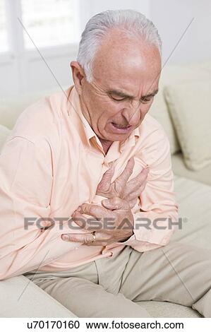 Stock Image - Man with chest pain. Fotosearch