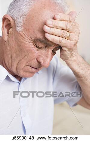Stock Photo - Man with headache. Fotosearch