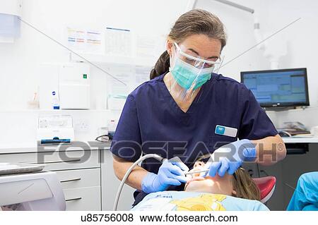 Stock Photo - Patient at dentist's. Fotosearch