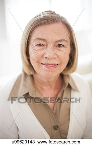 Stock Image - Portrait of smiling woman. Fotosearch