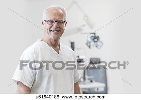 Senior male doctor dentist towards camera View Large Photo Image Stock Photography - Senior male doctor dentist towards camera. Fotosearch
