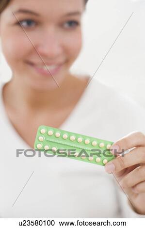 Woman holding contraceptive pills View Large Photo Image Stock Image - Woman holding contraceptive pills. Fotosearch