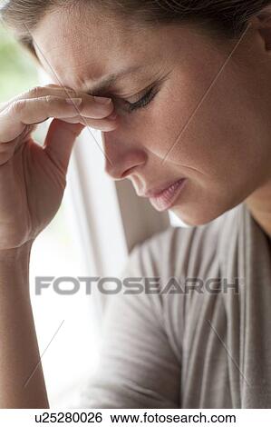 Woman rubbing eyes View Large Photo Image Stock Photograph - Woman rubbing eyes. Fotosearch