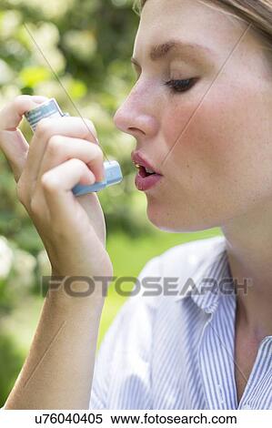 Woman using inhaler View Large Photo Image Stock Photography - Woman using inhaler. Fotosearch