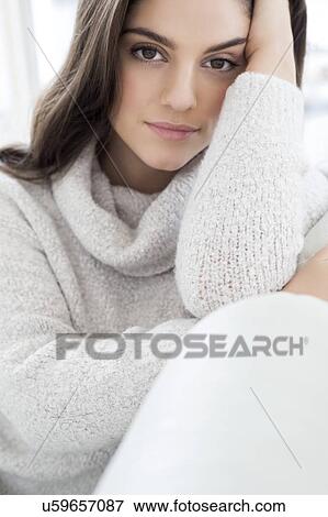 Stock Photo - Woman wearing knitted sweater. Fotosearch