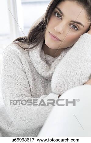 Woman wearing knitted sweater View Large Photo Image Stock Photo - Woman wearing knitted sweater. Fotosearch