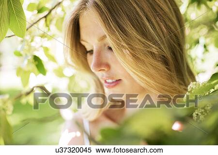 Woman with blonde hair and leaves View Large Photo Image Stock Photography - Woman with blonde hair and leaves. Fotosearch