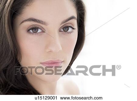Woman with brown hair looking at camera View Large Photo Image Stock Image - Woman with brown hair looking at camera. Fotosearch
