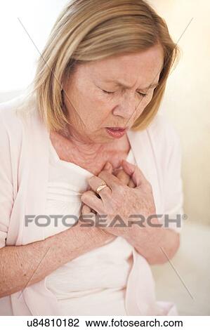 Woman with chest pain View Large Photo Image Stock Image - Woman with chest pain. Fotosearch