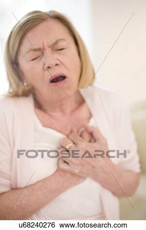 Woman with chest pain View Large Photo Image Stock Photograph - Woman with chest pain. Fotosearch