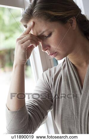 Woman with hand on forehead View Large Photo Image Stock Photo - Woman with hand on forehead. Fotosearch