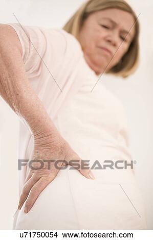 Picture - Woman with hip pain. Fotosearch