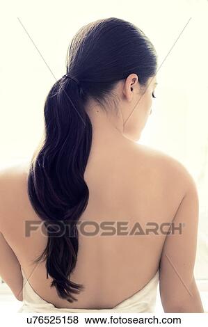 Woman with long brown hair in pony tail View Large Photo Image Stock Photo - Woman with long brown hair in pony tail. Fotosearch
