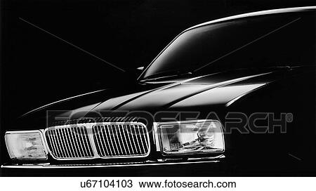 Stock Image - Black car, studio shot. Fotosearch