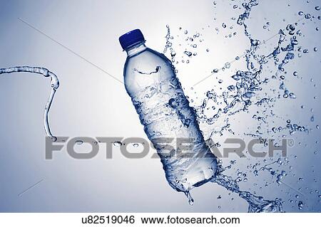 Stock Photograph - Bottle of mineral water and splashes. Fotosearch