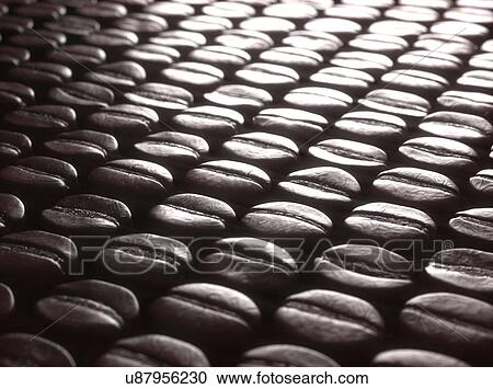 Stock Image - Coffee beans, close up. Fotosearch